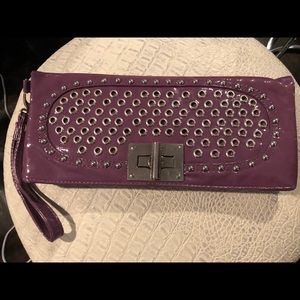 Purple leather clutch